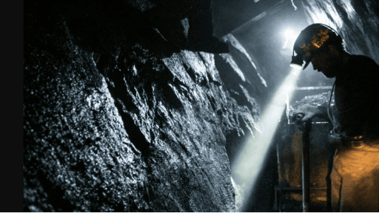 The scene of miners working in underground coal mines